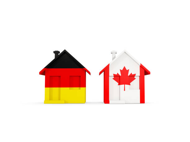 istock Two houses with flags of Germany and canada 1131317037