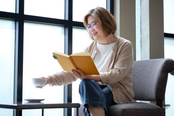istock Elderly woman relaxing in cafe. 1131320235