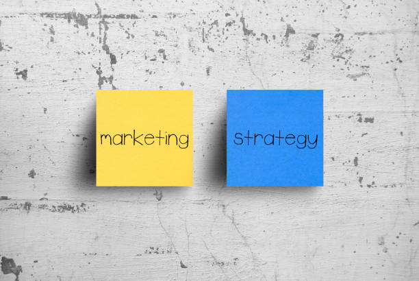 istock Sticky note on concrete wall, Marketing Strategy 1131322090