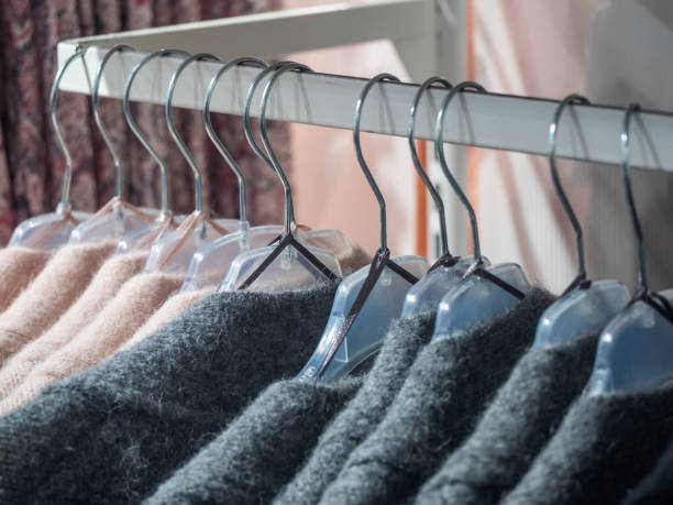 istock Clothes hang on a shelf in a designer clothes store 1131322156