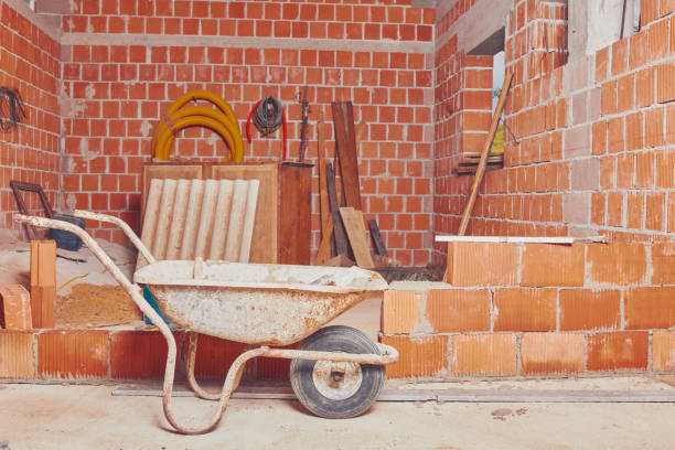 istock Real construction worker bricklaying the wall indoors. 1131325236