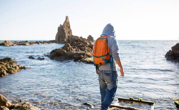 Man exploring Spanish coastline, Cabo de Gata - Nijar Natural Park, Spain