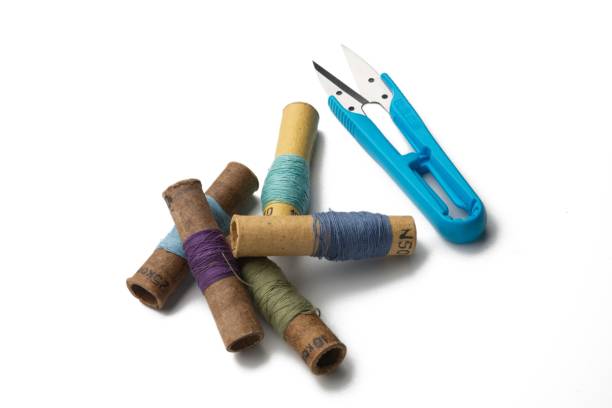 istock group retro of thread spools white background with repairing scissors 1131331761