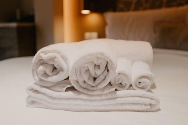 istock white towel decoration on bed in bed room interior - Image 1131332171