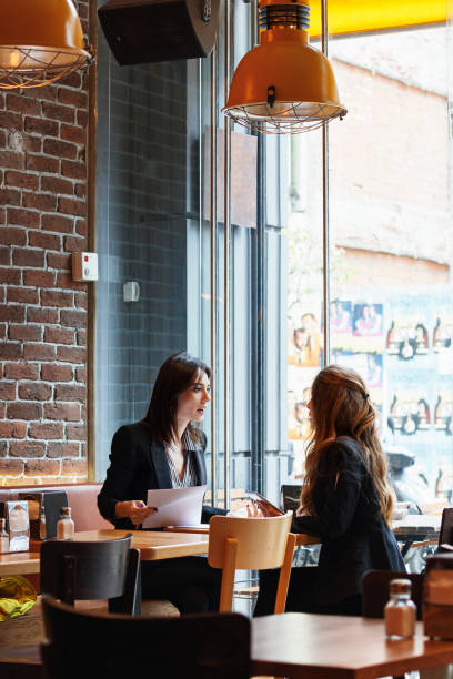 istock Modern business people working at a cafe 1131334650
