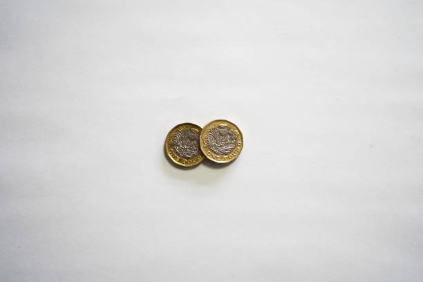 istock Two one point coins next to each other isolated on white 1131334811