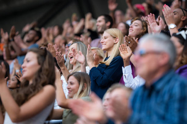 istock Group of spectators cheering in stadium 1131336414