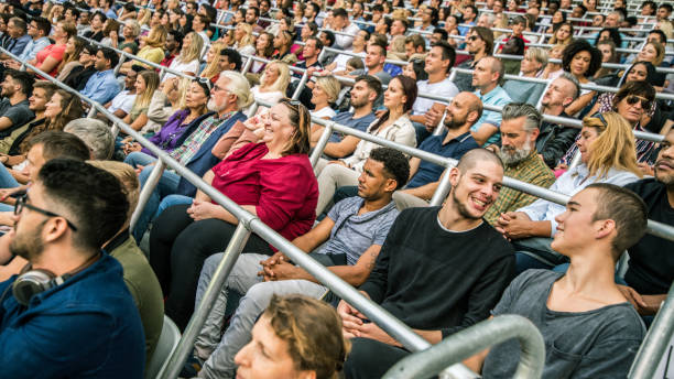istock Group of spectators cheering in stadium 1131336419