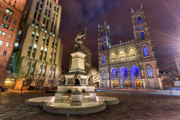 Place D'Armes at Night - Montreal, Canada Montreal Notre-Dame Basilica in Place D'Armes in Montreal, Quebec, Canada. place darmes montreal stock pictures, royalty-free photos & images