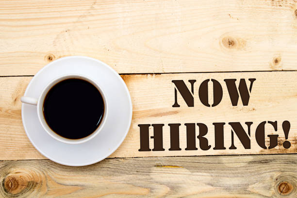istock new hiring, on wooden background 1131338975