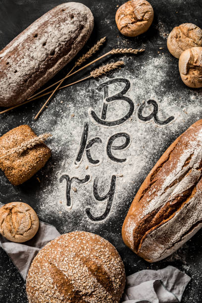 istock Bakery - sing on flour with breads around - poster design 1131340882