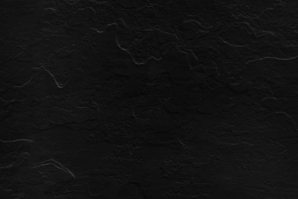 istock background of black stone texture. 1131341953