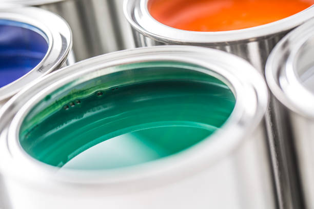 istock Full of multicolored paint cans on white table. 1131342888