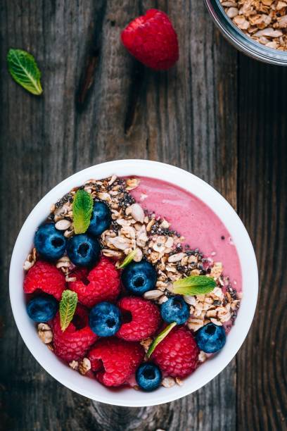 istock Acai smoothie and granola bowl with fresh raspberries and blueberries 1131343769