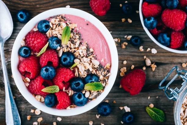 istock Acai smoothie and granola bowl with fresh raspberries and blueberries 1131343784