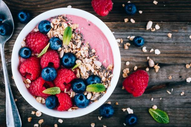istock Acai smoothie and granola bowl with fresh raspberries and blueberries 1131343807
