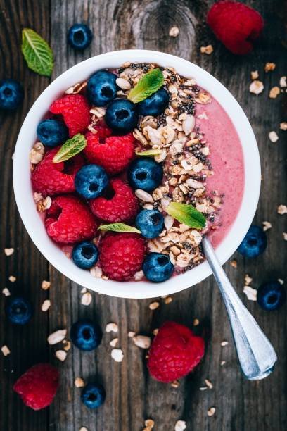 istock Acai smoothie and granola bowl with fresh raspberries and blueberries 1131343814