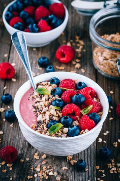 istock Acai smoothie and granola bowl with fresh raspberries and blueberries 1131343905