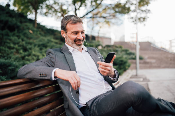 istock Man looking at mobile phone and smiling 1131343968