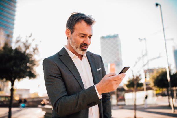 istock Business man looking at mobile phone 1131345508