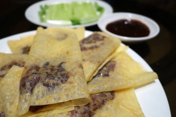 istock Chinese roast duck wrapped in pancakes 1131345560