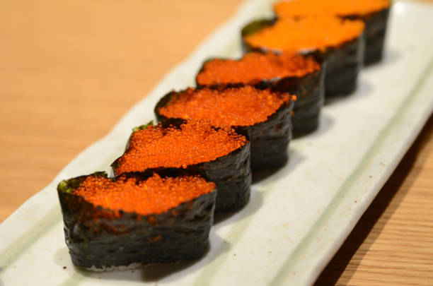Tobiko Gunkan Sushi (Nori wrapped Flying Fish Roe Sushi) on a plate
