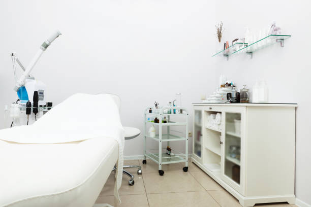 Modern luxury beauty salon interior with elegant pink chairs, marble counters, and soft lighting