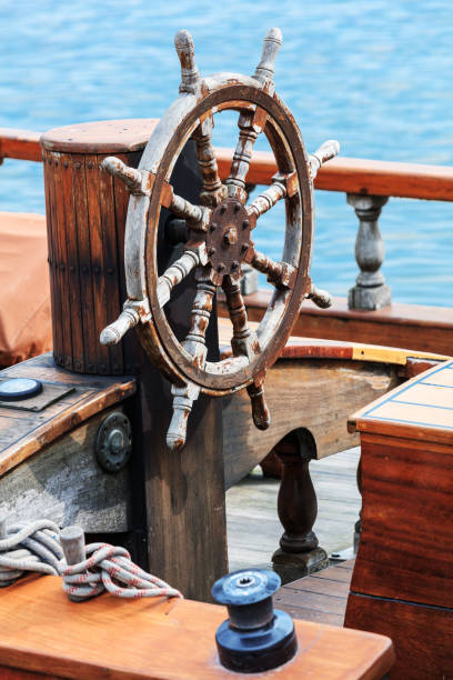 old boat steering wheel from wood - sailing ship nautical vessel rigging industrial ship imagens e fotografias de stock