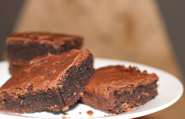 istock fresh flavored chocolate brownies on a white plate 1131350494
