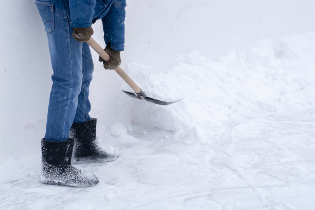 istock Man cleans the ice rink with a big snow shovel 1131350565