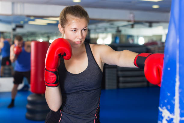 istock Woman boxing in gym 1131352087