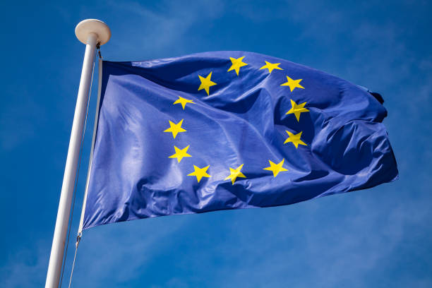 istock Flag of Europe over blue sky 1131352271