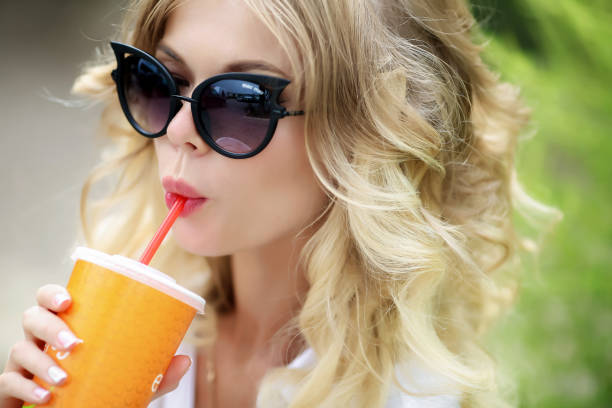 istock Woman drinking juice on a hot summer day. 1131353096