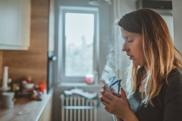 istock Woman suffering from allergy and asthma 1131354660