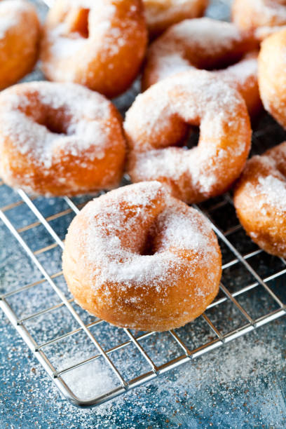 istock Bunch Of Donuts On A Cooling Tray 1131356404