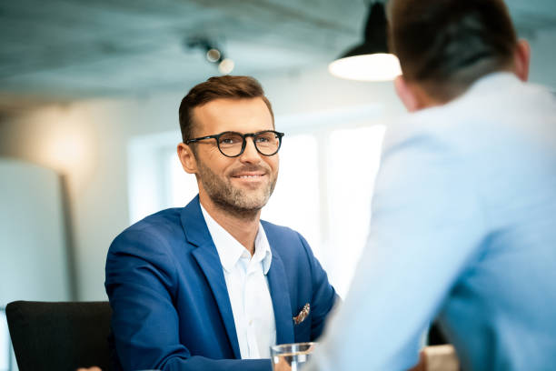 istock Businessman looking at colleague during meeting 1131356603