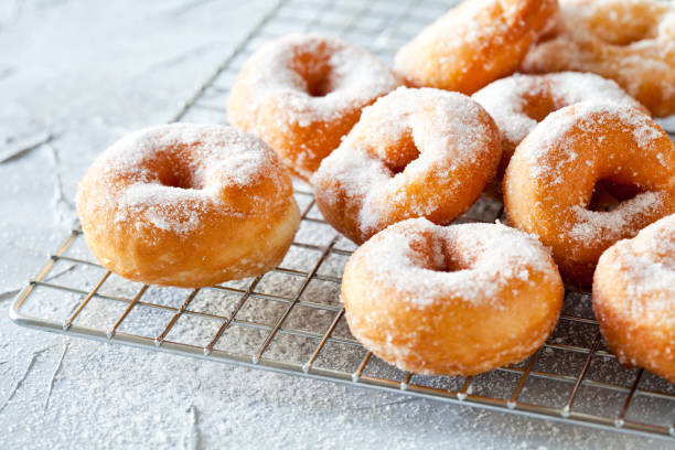 istock Bunch Of Donuts With Powdered Sugar 1131356637