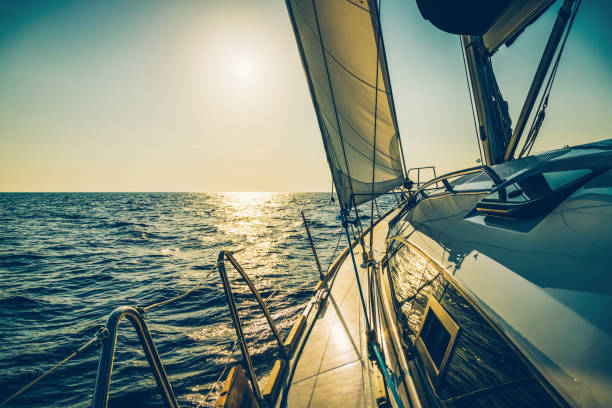Sailing with sailboat at sunset, Dalmatia, Croatia.