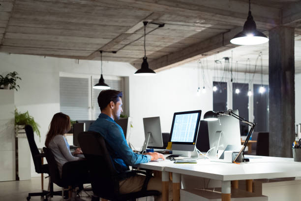 istock Business colleagues working late at office 1131359344