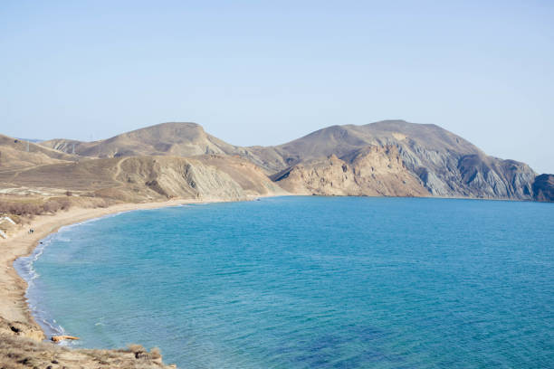 istock Sandy hills with turquoise sea and blue sky. 1131360363