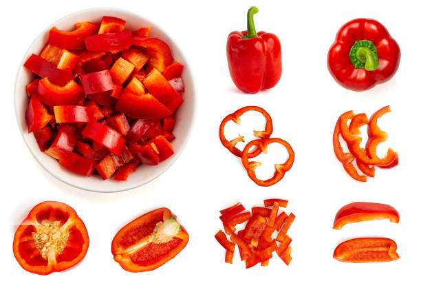 set of fresh whole and sliced bell pepper isolated on white background. top view - chopped imagens e fotografias de stock