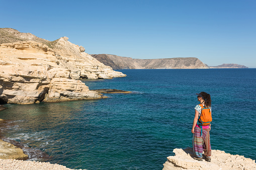 Woman exploring Spanish coastline, Cabo de Gata - Nijar Natural Park, Spain
