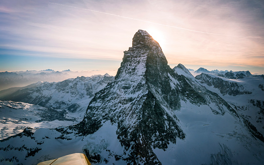 Photo of the sun behind the Matterhorn taken inflight