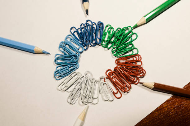 istock Colored paperclips in a circle and pencils 1131365367