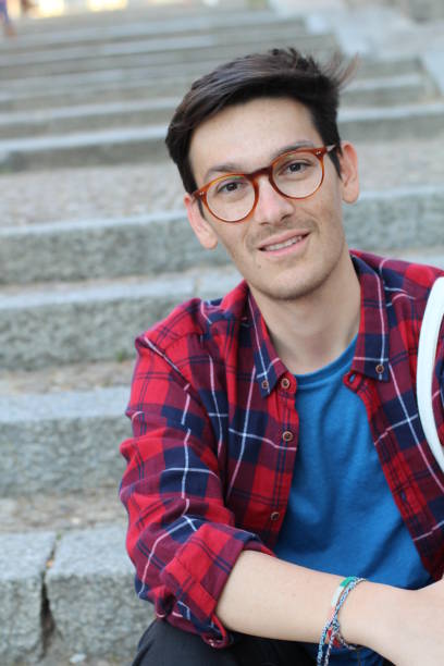 istock Handsome young hispanic male smiling outdoors 1131365542