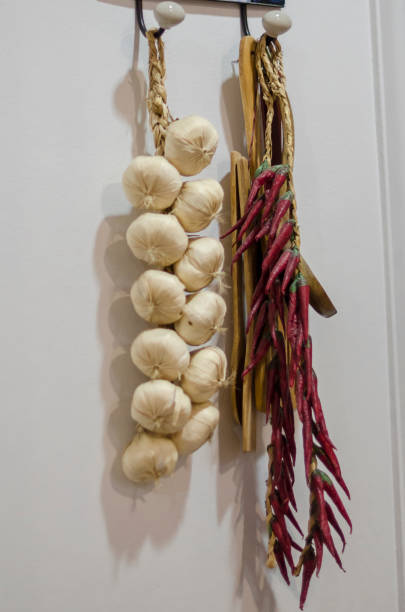istock Dried garlic and hot paper hanging 1131365654