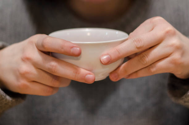 istock Cup of red tea in the hands 1131366638