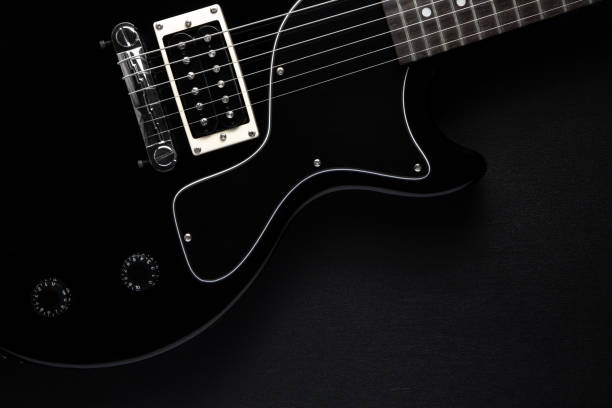 istock black electric guitar on a black back 1131366853