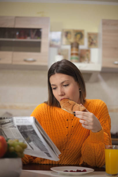 istock Woman having breakfast at home. 1131369939