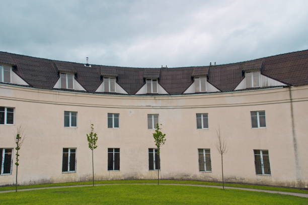 istock Image of white three-storey rounded residential building 1131370915